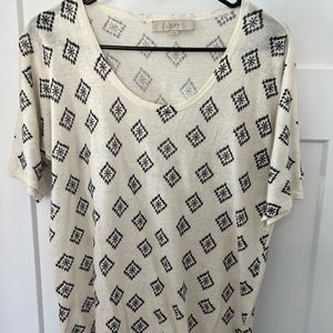 Navy blue and white blouse. Low cut